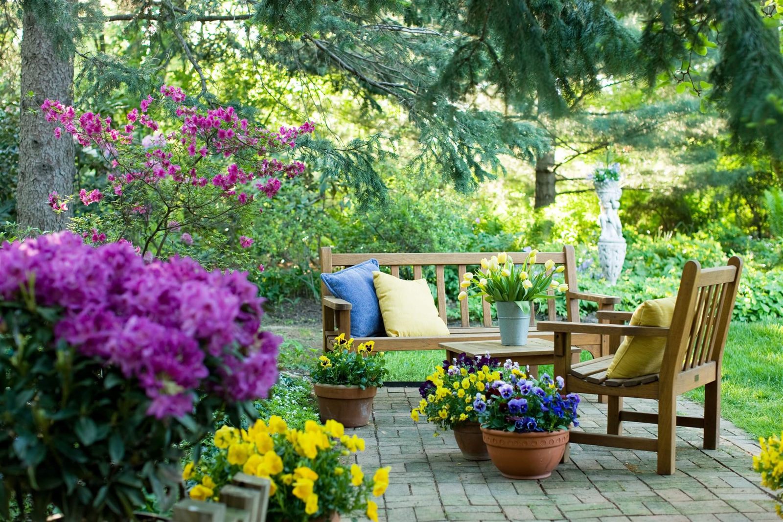 Established garden with seasonal color and a brick patio in Wesley Chapel, FL