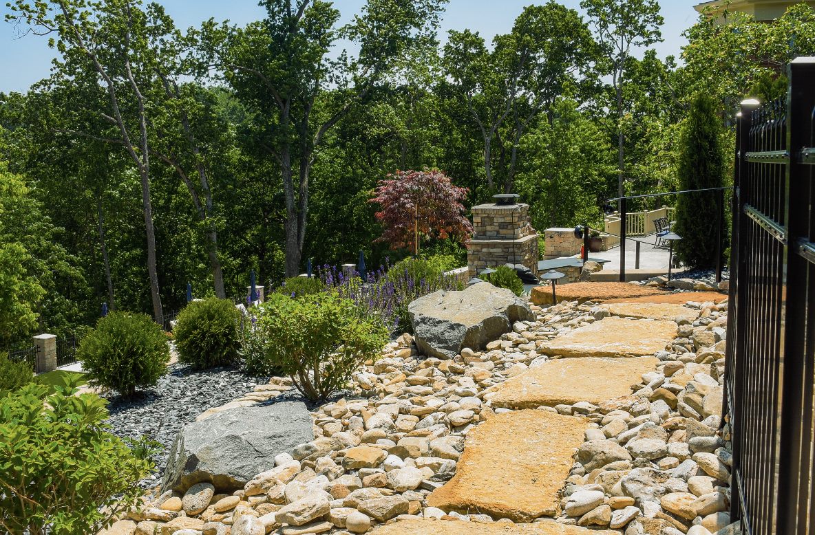 Natural stone path and rock garden with drought-friendly plantings