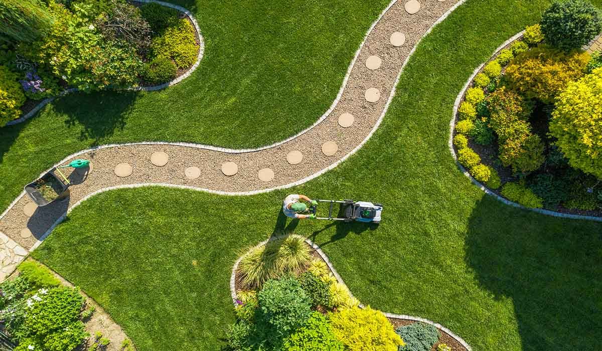 Aerial view of curved garden paths and a freshly mowed lawn